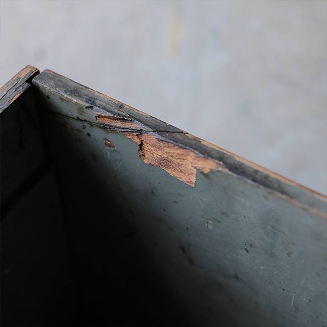 Wooden box with peeling paint