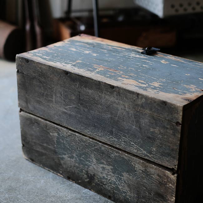Wooden box with peeling paint