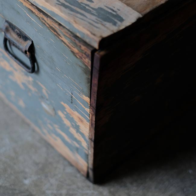 Wooden box with peeling paint