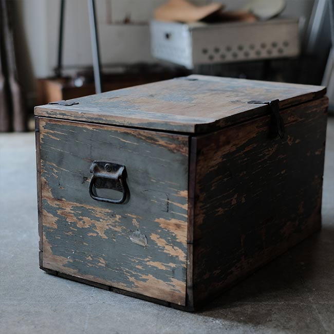 Wooden box with peeling paint