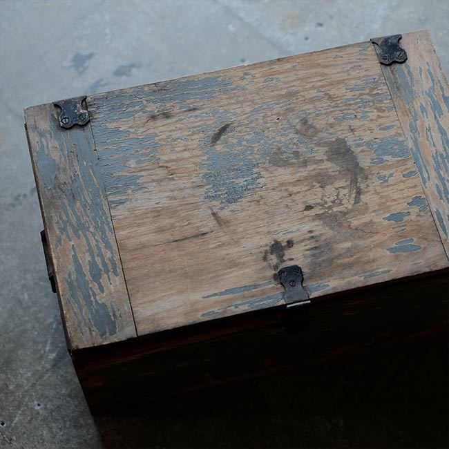 Wooden box with peeling paint