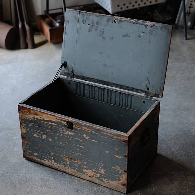 Wooden box with peeling paint