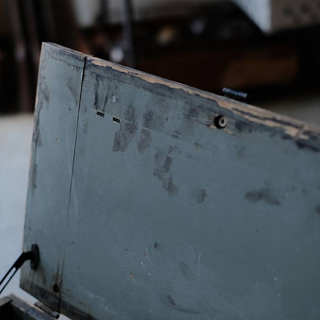 Wooden box with peeling paint
