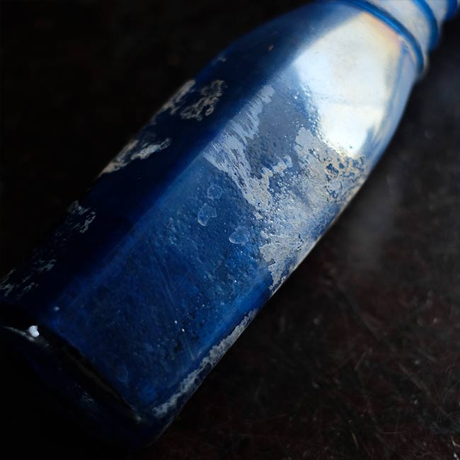 Silvered blue bottle
