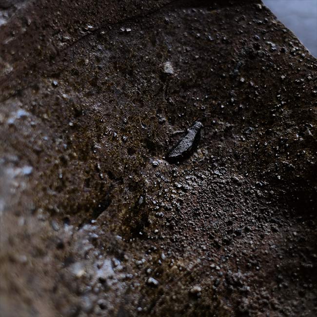 the bottom of a broken pot
