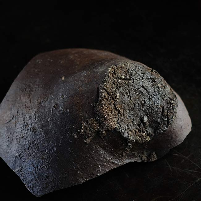the bottom of a broken pot
