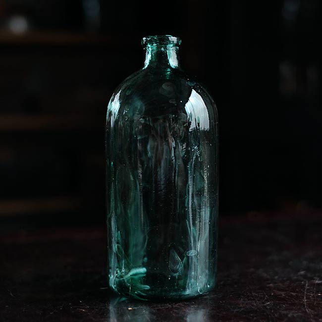 Aqua green medicine bottle