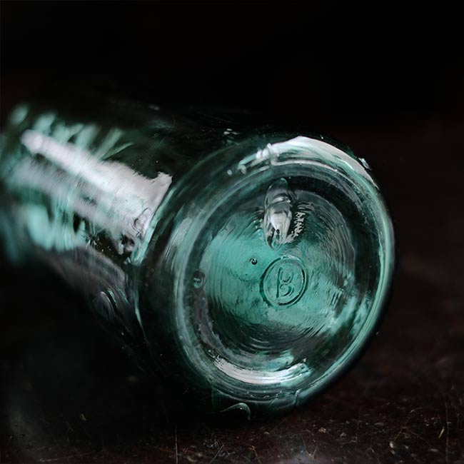 Aqua green medicine bottle