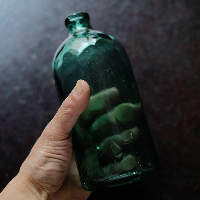 Aqua green medicine bottle