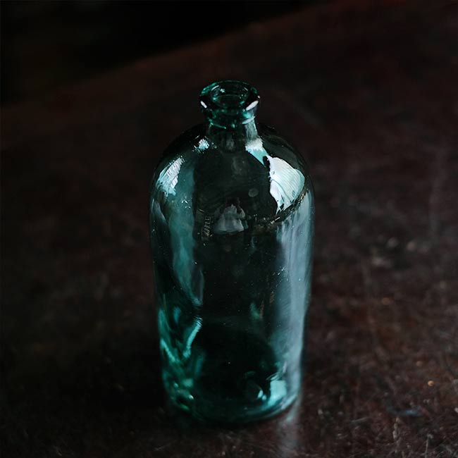 Aqua green medicine bottle