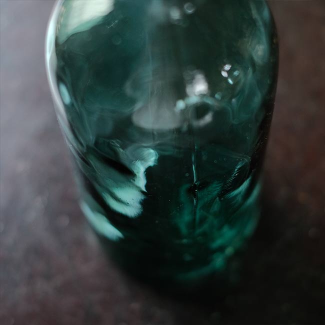 Aqua green medicine bottle