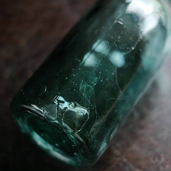 Aqua green medicine bottle
