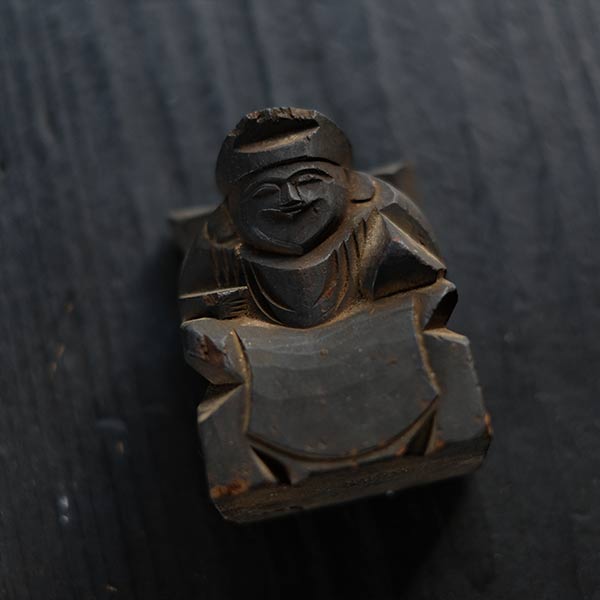 Wooden carving of Ebisu