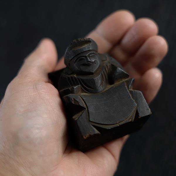 Wooden carving of Ebisu