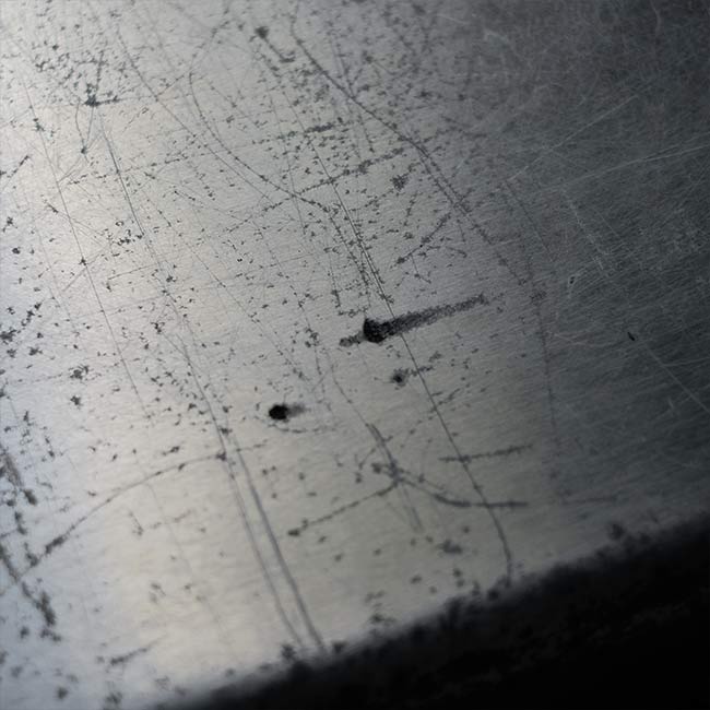 A well-worn aluminum trunk
