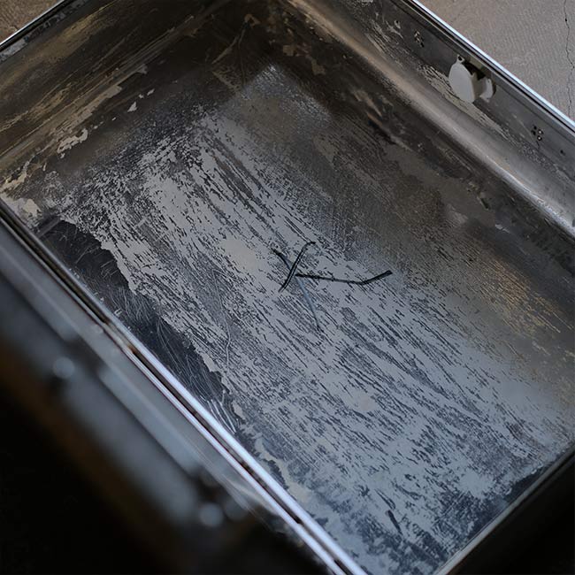 A well-worn aluminum trunk