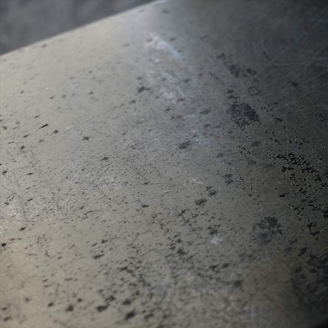 A well-worn aluminum trunk