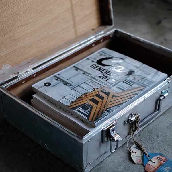 A well-worn aluminum trunk