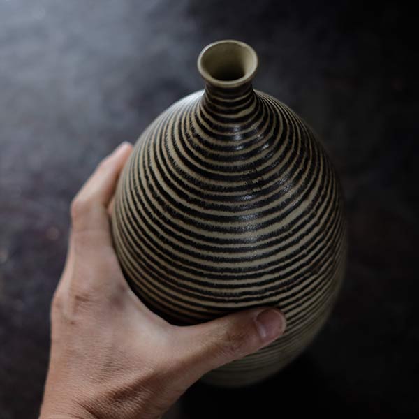 Sake bottle with circular line design