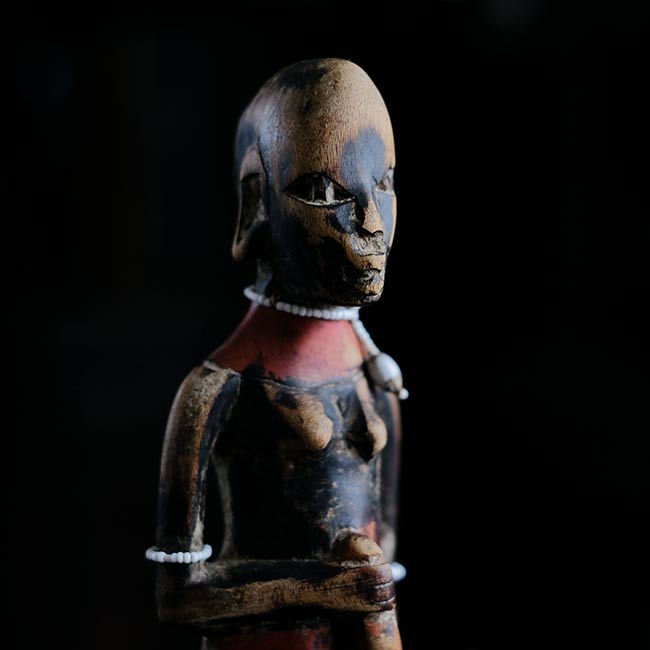 Wooden carving of a Masai woman