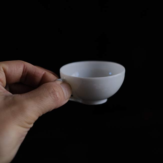 Small white porcelain cup