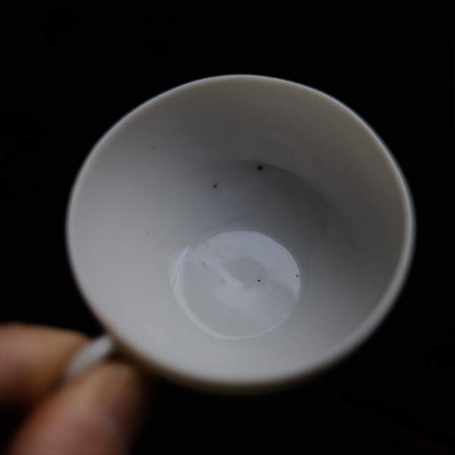 Small white porcelain cup