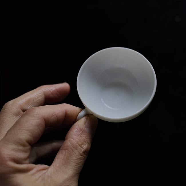 Small white porcelain cup