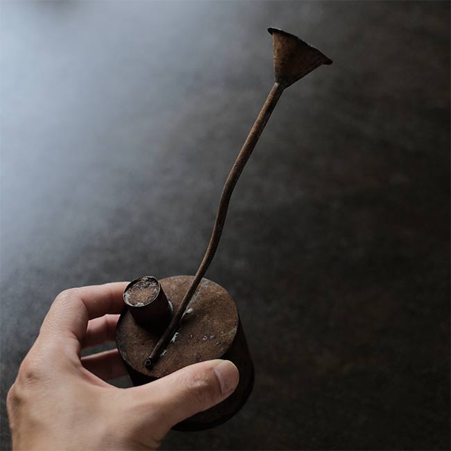 can with a funnel