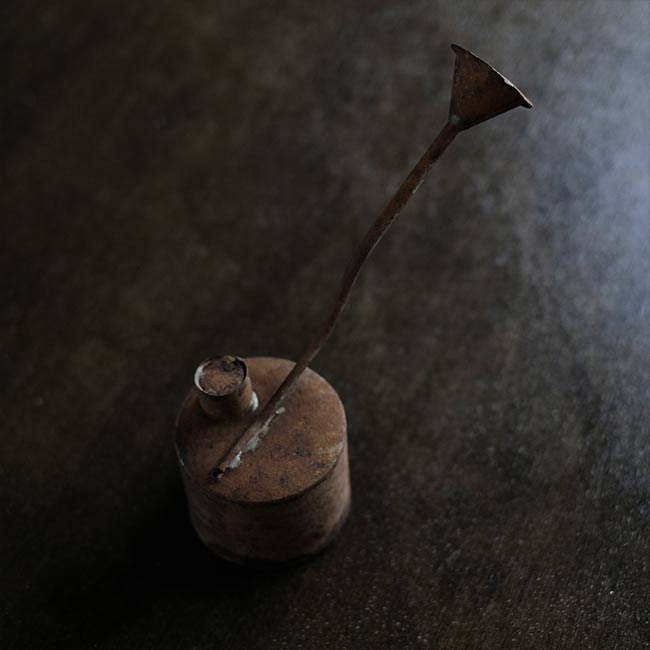 can with a funnel