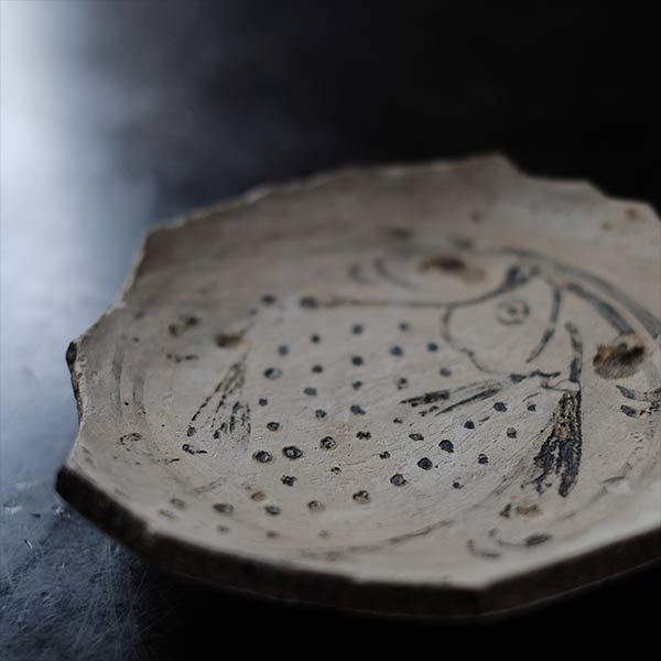 Remains of a fish-patterned bowl