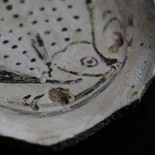 Remains of a fish-patterned bowl