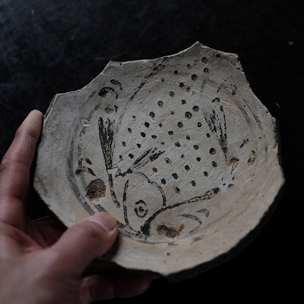 Remains of a fish-patterned bowl