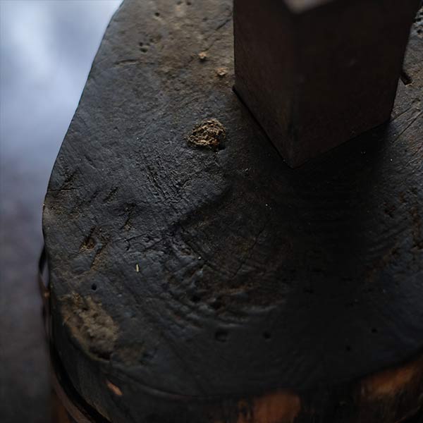 Anvil and wooden stand
