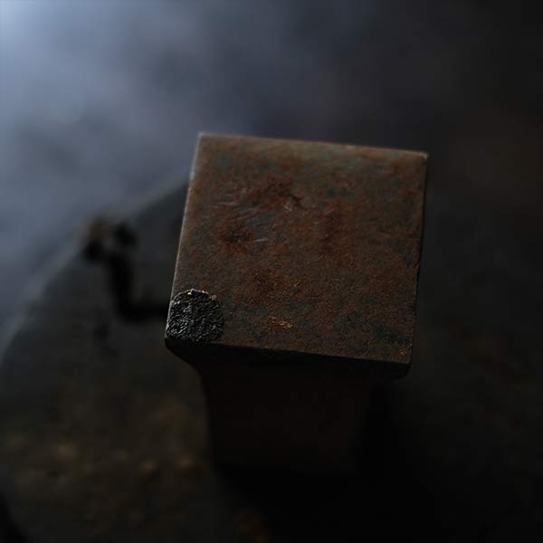 Anvil and wooden stand