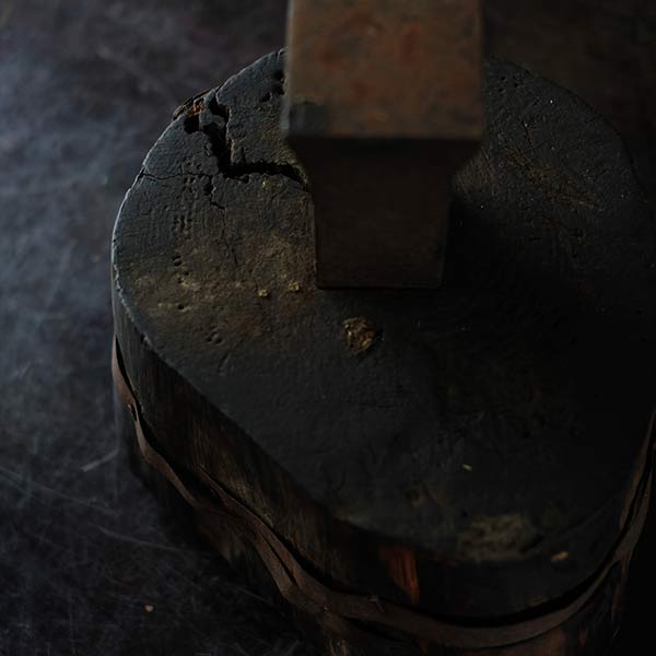 Anvil and wooden stand