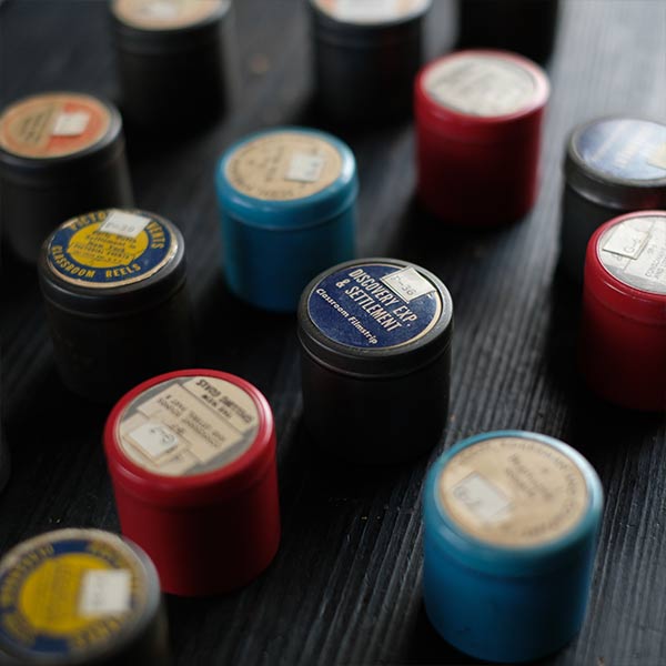 Tin case containing film