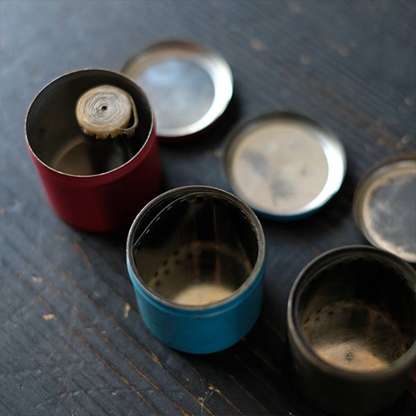 Tin case containing film