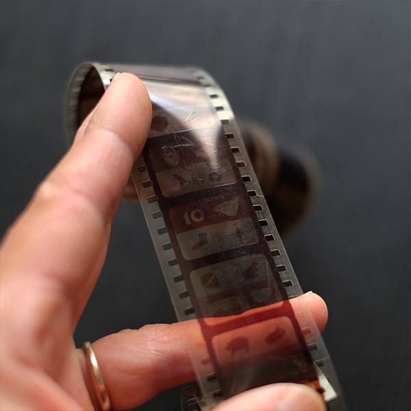 Tin case containing film