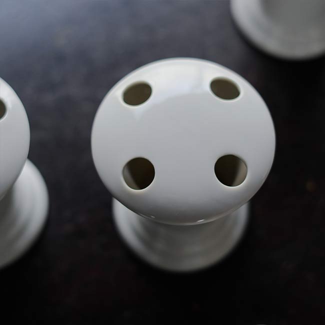 White porcelain toothbrush holder