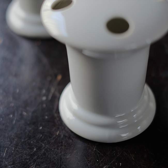 White porcelain toothbrush holder