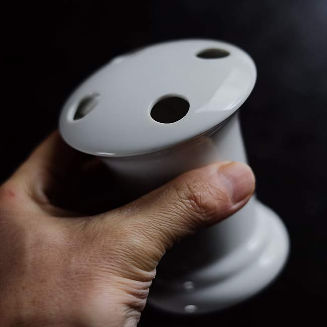 White porcelain toothbrush holder