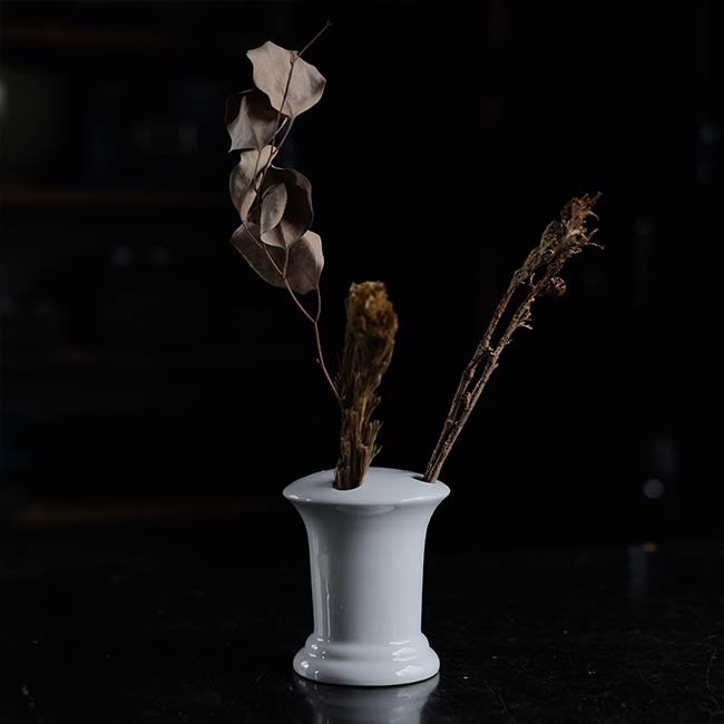 White porcelain toothbrush holder