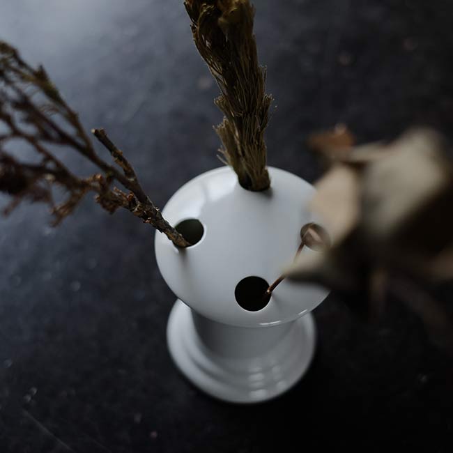 White porcelain toothbrush holder