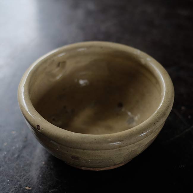 Yellow glazed sake cup