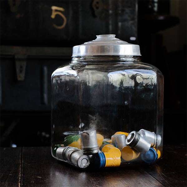 Irregular hexagonal glass bottle