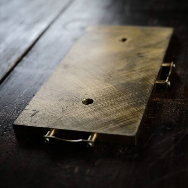 Brass plate with a small handle