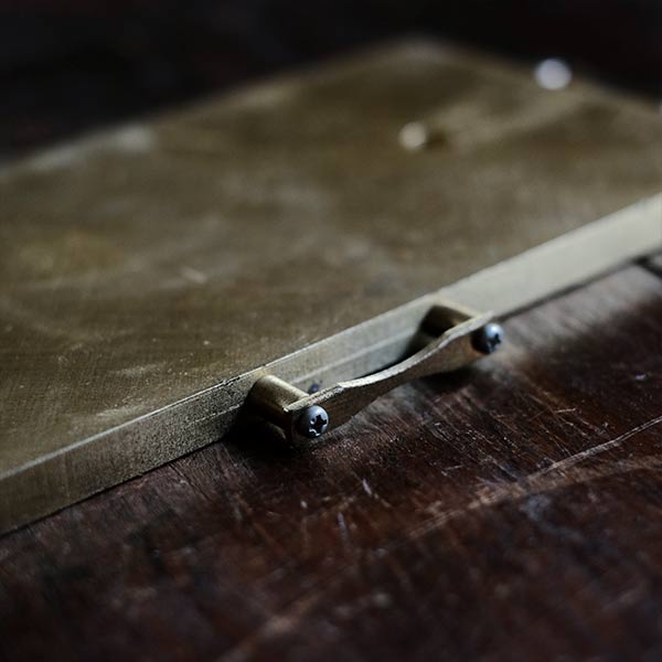 Brass plate with a small handle