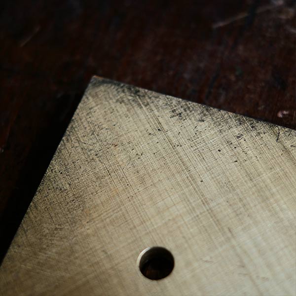 Brass plate with a small handle