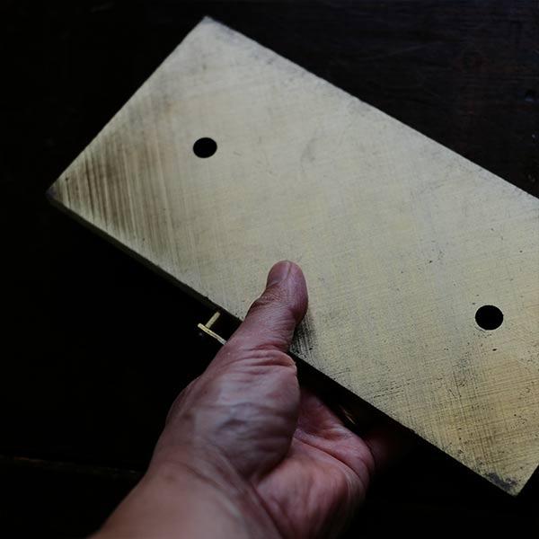 Brass plate with a small handle