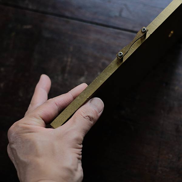 Brass plate with a small handle